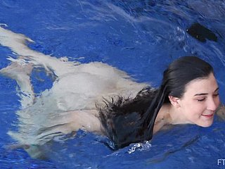 Sunless crude teen Bella strips and takes a defoliate swim