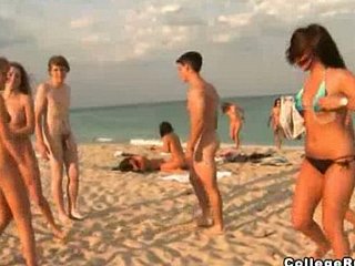 Bikini teens gang unshod on beach